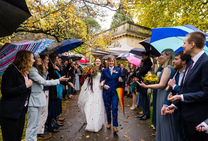 Rainy wedding day with umbrellas, Rich Howman